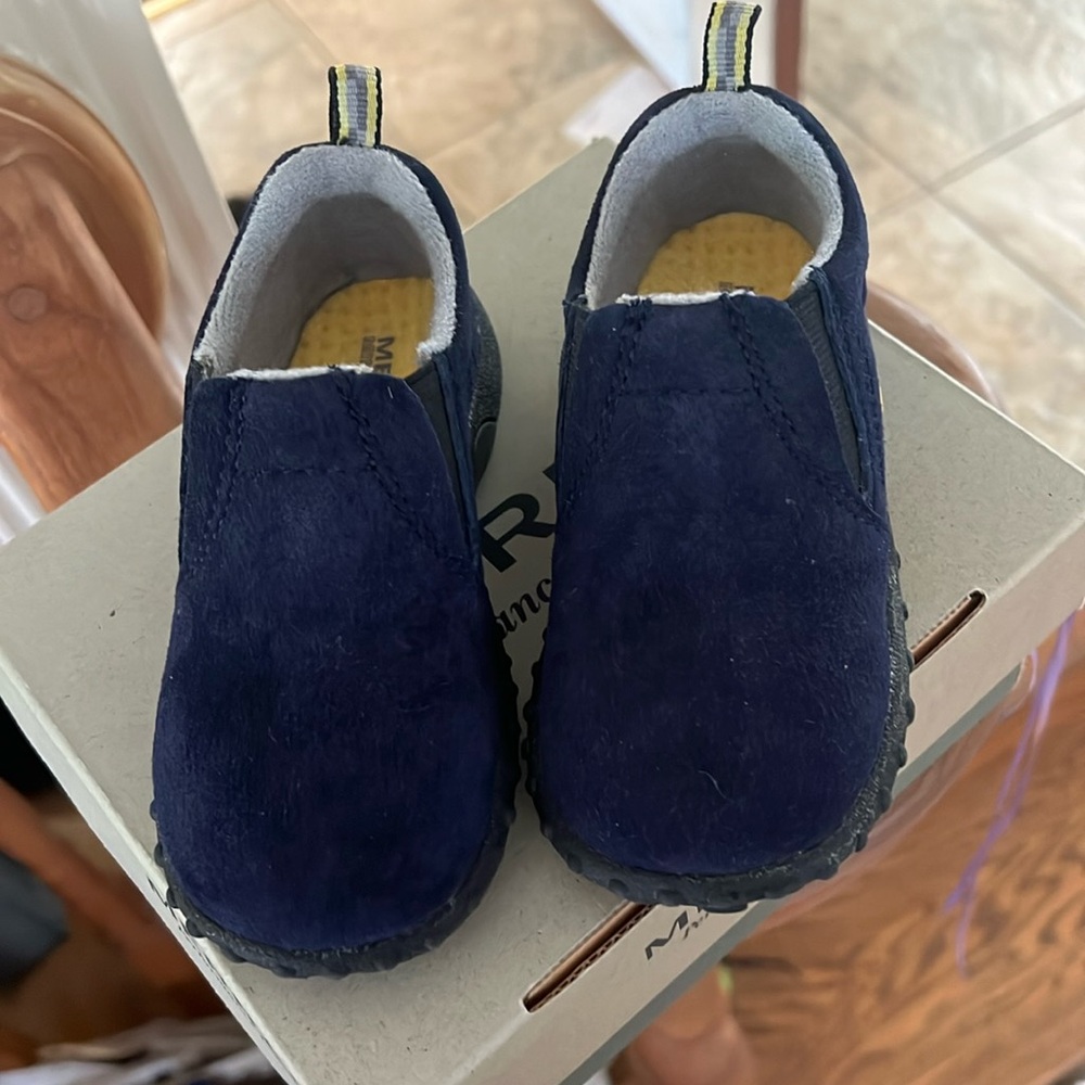 Brand new Merrell slips on shoes. Material is suede.